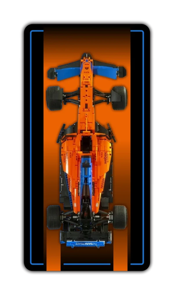 A vertical wall display mockup designed for a LEGO Technic scale model car. The background features a striking vertical gradient that transitions from a deep, glowing orange in the center to a dark charcoal gray at the borders, framed by a thin neon blue accent line. At the center is a top-down view of the bright orange and blue McLaren MCL39 F1 racing car.