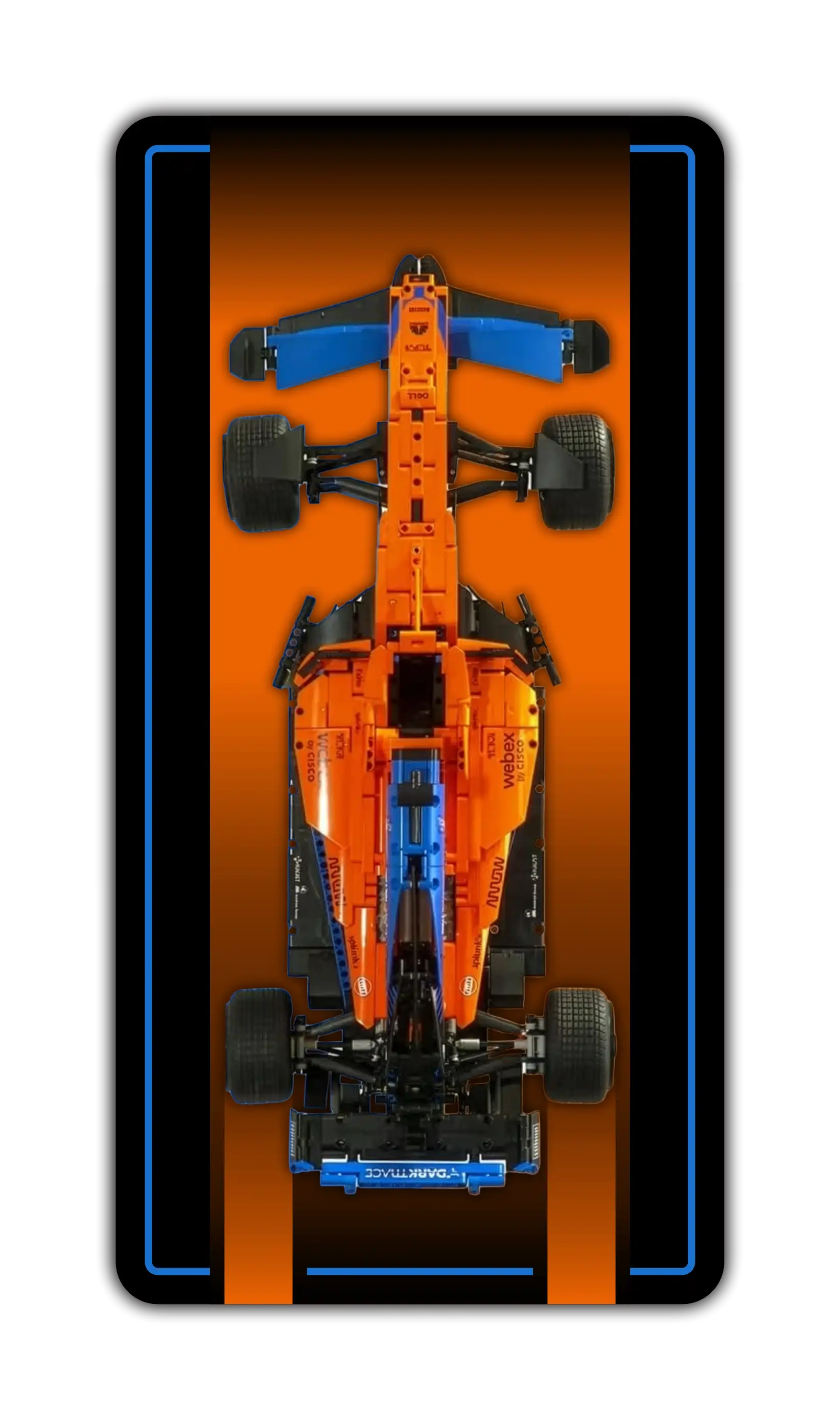 A vertical wall display mockup designed for a LEGO Technic scale model car. The background features a striking vertical gradient that transitions from a deep, glowing orange in the center to a dark charcoal gray at the borders, framed by a thin neon blue accent line. At the center is a top-down view of the bright orange and blue McLaren MCL39 F1 racing car.